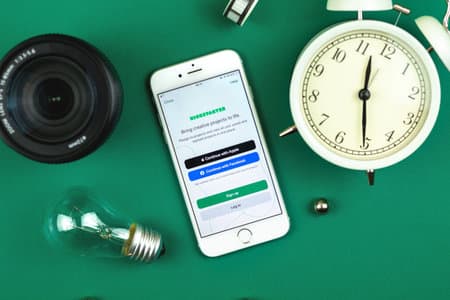 Kharkov, Ukraine - February 22, 2021: Kickstarter app on Apple smartphone screen, creative flat lay background photo